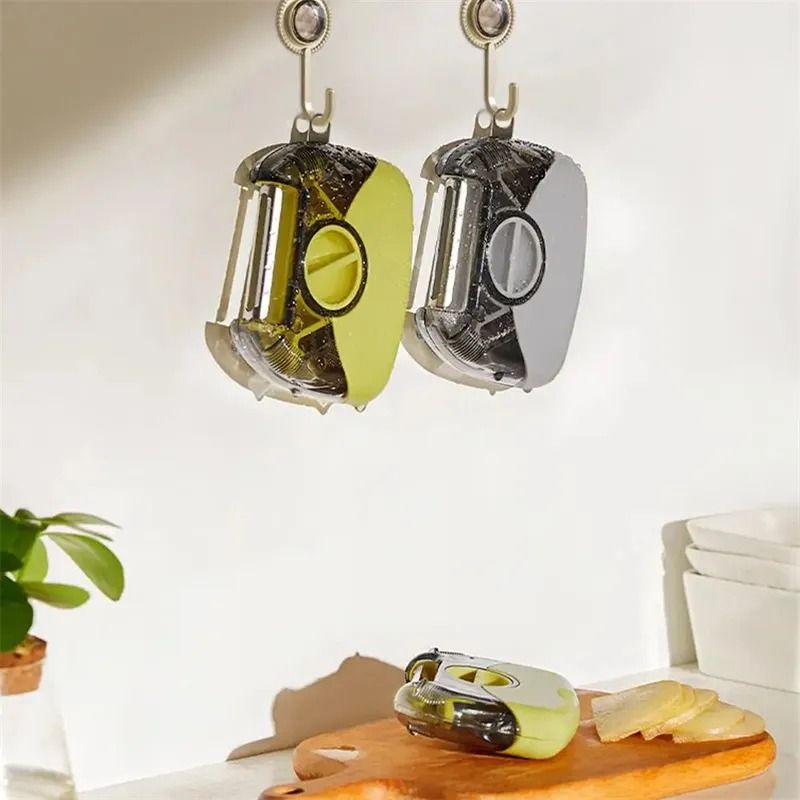 Two TriPeel units hanging from kitchen hooks